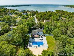 63 East Tiana Road Hampton Bays, NY 11946 - Photo 24 of 30 a view of a yard with an outdoor seating
