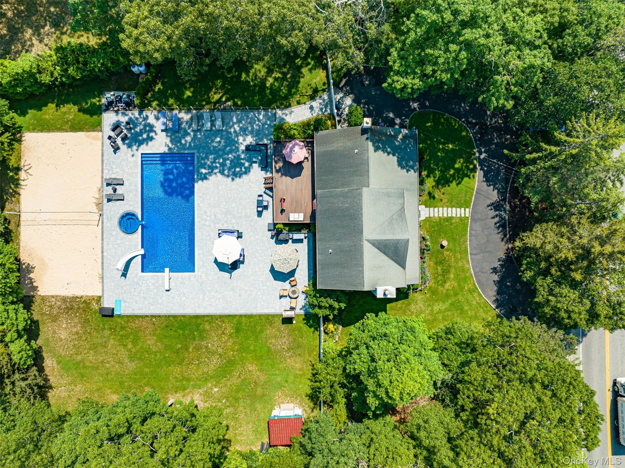 63 East Tiana Road Hampton Bays, NY 11946 - Photo 26 of 30 an aerial view of residential house with outdoor space and swimming pool