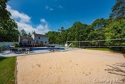 63 East Tiana Road Hampton Bays, NY 11946 - Photo 29 of 30 a view of swimming pool with outdoor seating and plants