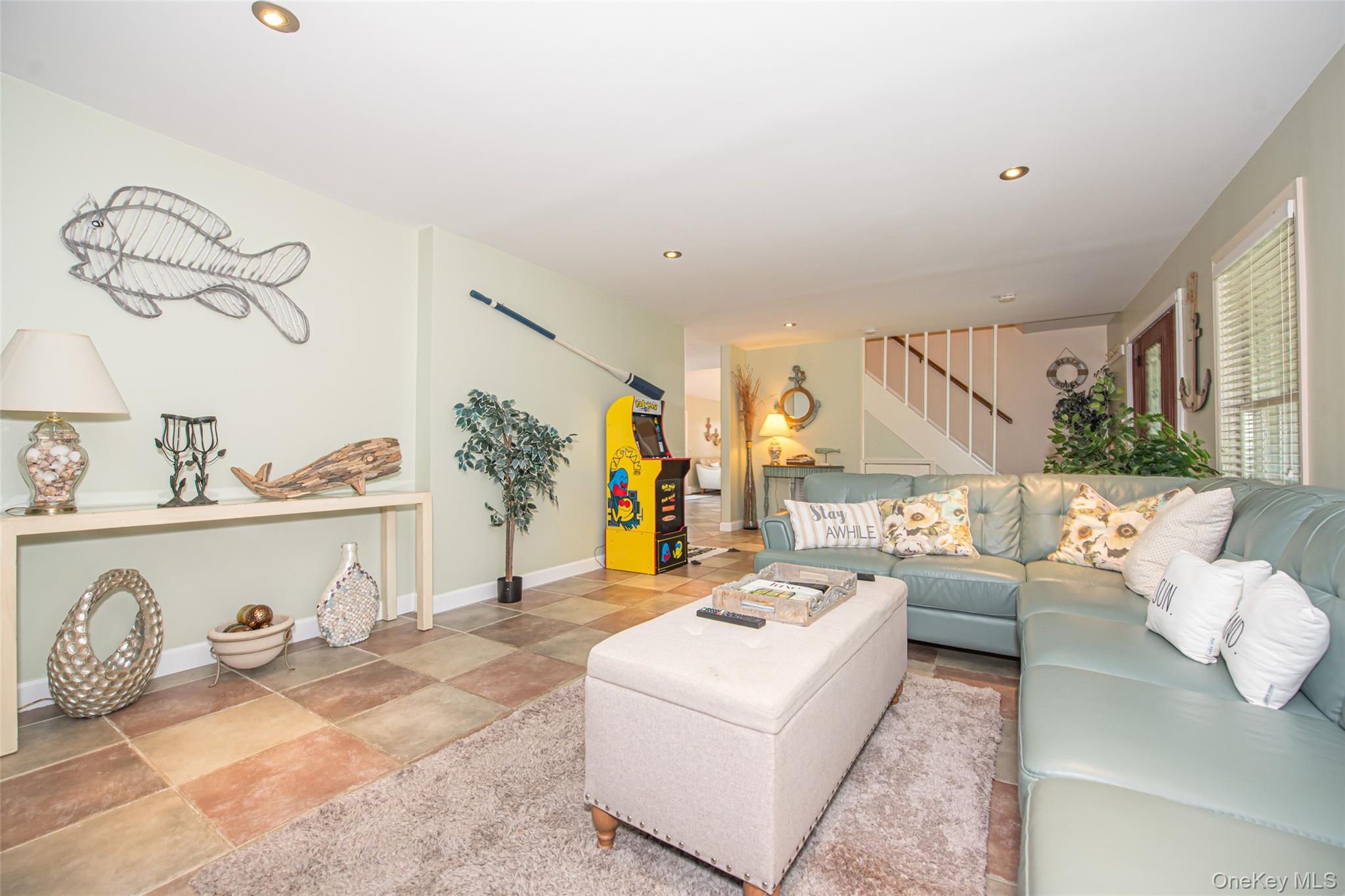 63 East Tiana Road Hampton Bays, NY 11946 - Photo 8 of 30 a living room with furniture and a table