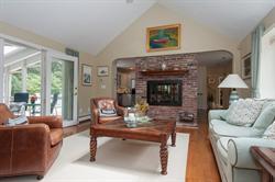 608 Old Post Road Cotuit, MA 02635 - Photo 12 of 30 a living room with furniture and a fireplace