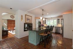 608 Old Post Road Cotuit, MA 02635 - Photo 13 of 30 a view of a dining room with furniture and a chandelier