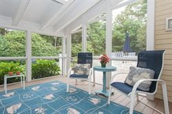 608 Old Post Road Cotuit, MA 02635 - Photo 15 of 30 a living room with furniture and a floor to ceiling window