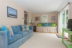 608 Old Post Road Cotuit, MA 02635 - Photo 16 of 30 a living room with furniture and a flat screen tv