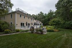 608 Old Post Road Cotuit, MA 02635 - Photo 21 of 30 a white house that has a big yard and large trees