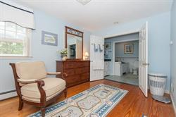 608 Old Post Road Cotuit, MA 02635 - Photo 23 of 30 a bedroom with a bed and wooden floor