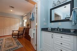608 Old Post Road Cotuit, MA 02635 - Photo 24 of 30 a hallway with sink and mirror
