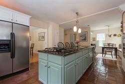 608 Old Post Road Cotuit, MA 02635 - Photo 5 of 30 a kitchen with stainless steel appliances granite countertop a sink stove and refrigerator