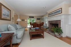 608 Old Post Road Cotuit, MA 02635 - Photo 7 of 30 a living room with furniture and a fireplace