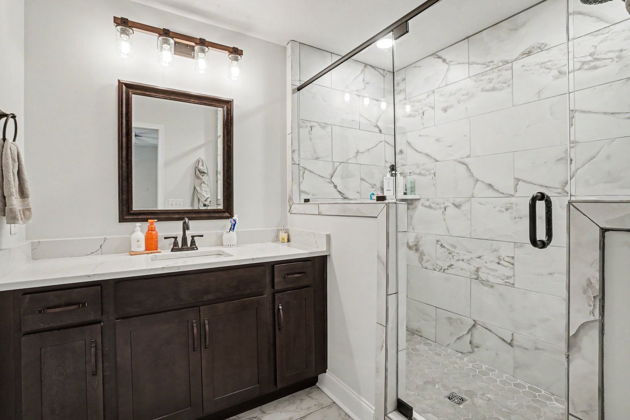 1415 Southside Road Southside, TN 37171 - Photo 21 of 35 a bathroom with a shower sink and mirror