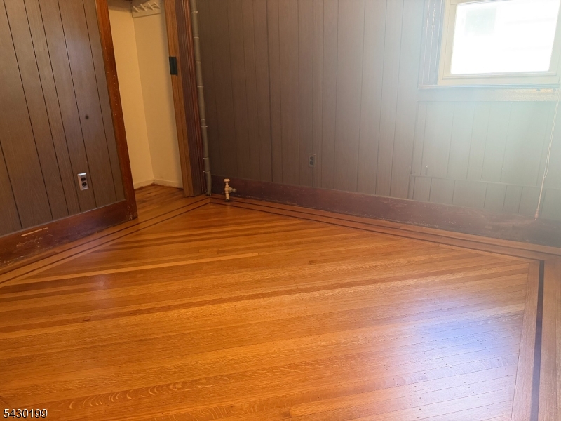 72 Baldwin Place, Unit 2 Bloomfield, NJ 07003 - Photo 16 of 24 a view of empty room with wooden floor
