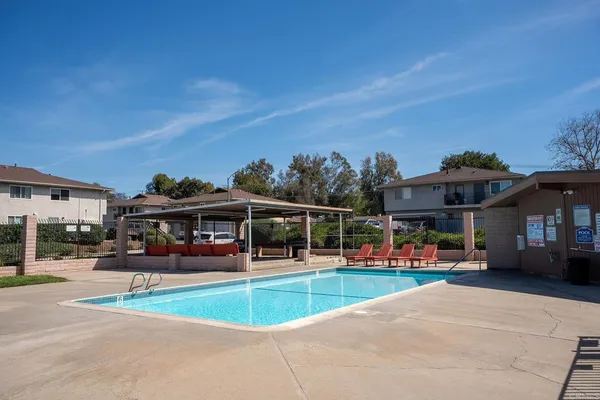 a view of a swimming pool with a patio