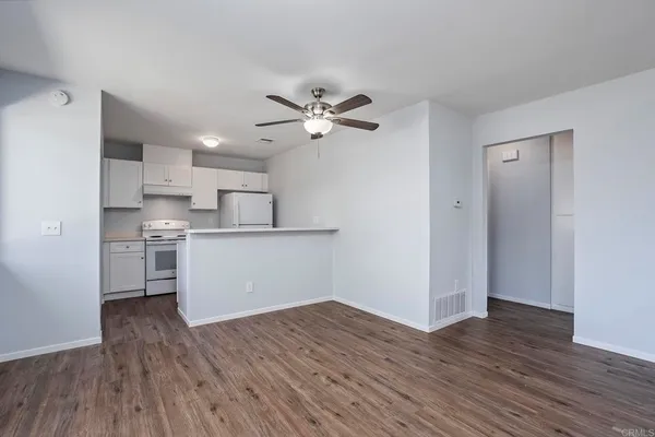 a view of kitchen with wooden floor and window