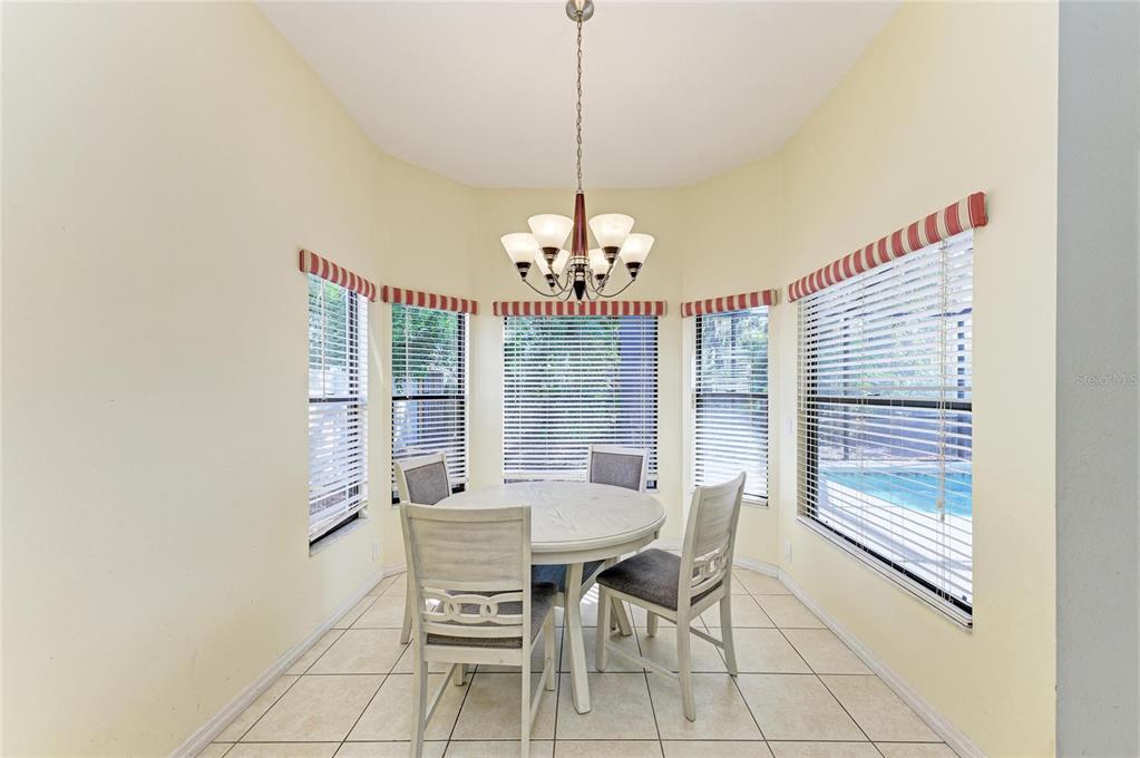 5045 82nd Way East Sarasota, FL 34243 - Photo 16 of 34 a dining room with furniture and window