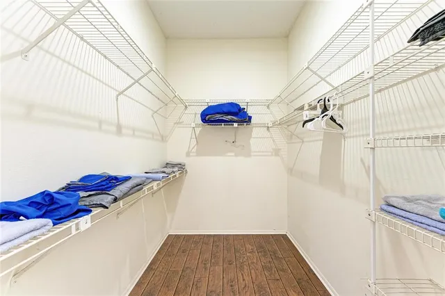 a bedroom with a bed and a rug