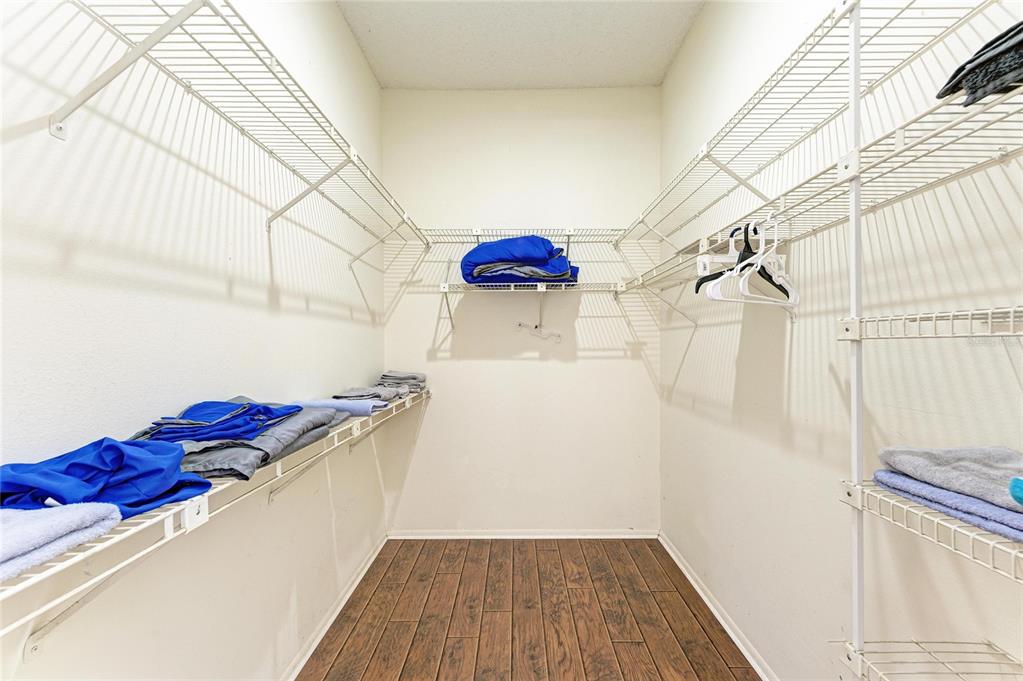 5045 82nd Way East Sarasota, FL 34243 - Photo 22 of 34 a bedroom with a bed and a rug