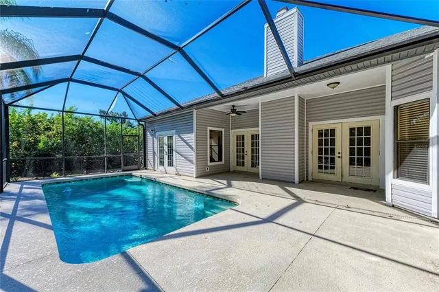 a view of a house with backyard porch and sitting area