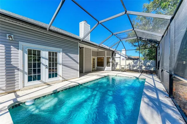 a view of swimming pool with seating area