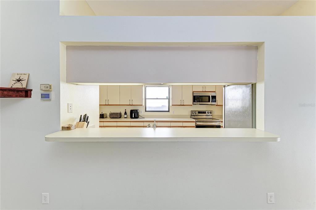 5045 82nd Way East Sarasota, FL 34243 - Photo 10 of 34 a view of kitchen with furniture and refrigerator