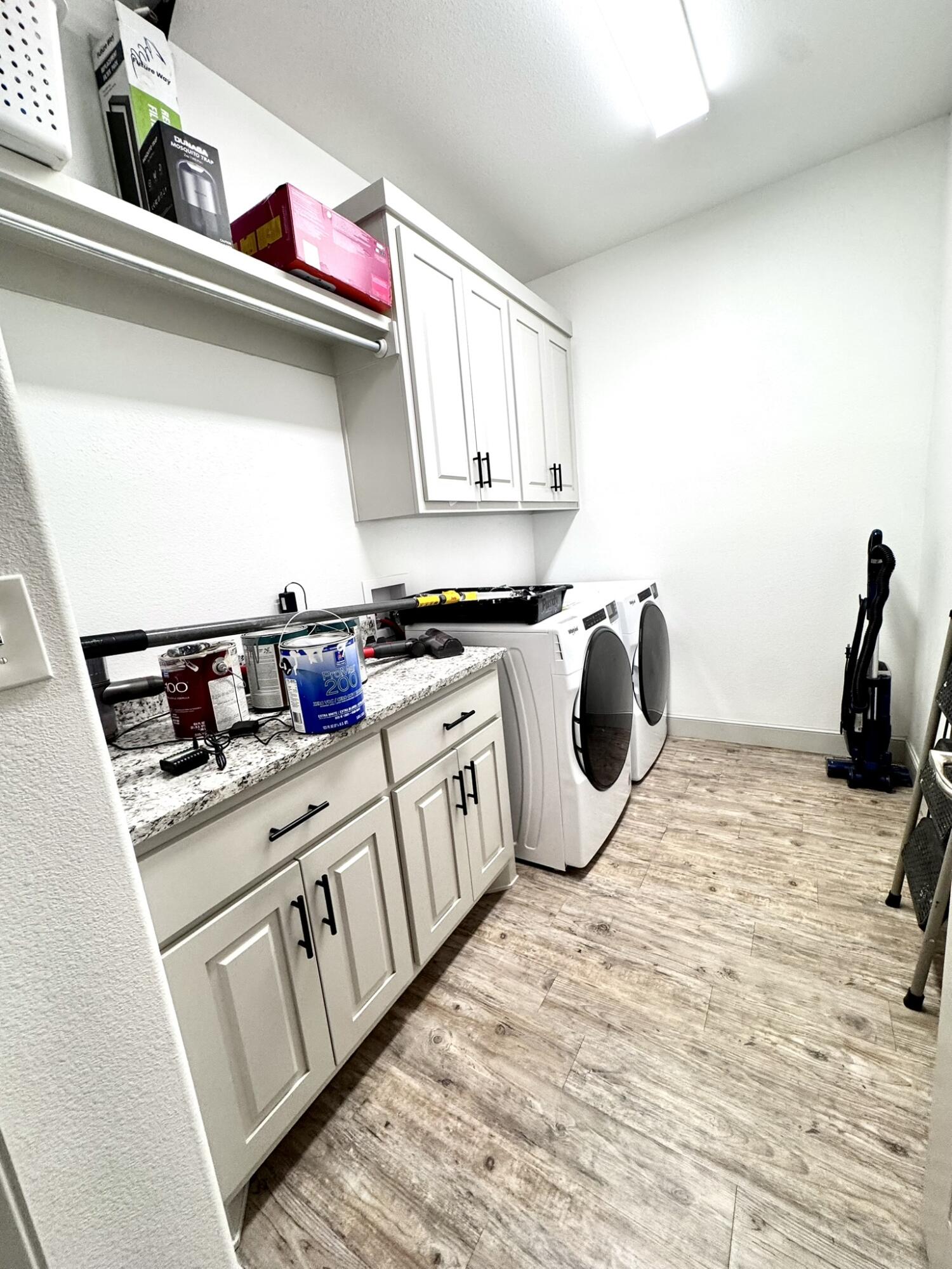 5615 115th Street Lubbock, TX 79424 - Photo 23 of 31 a kitchen with a stove a sink and a refrigerator