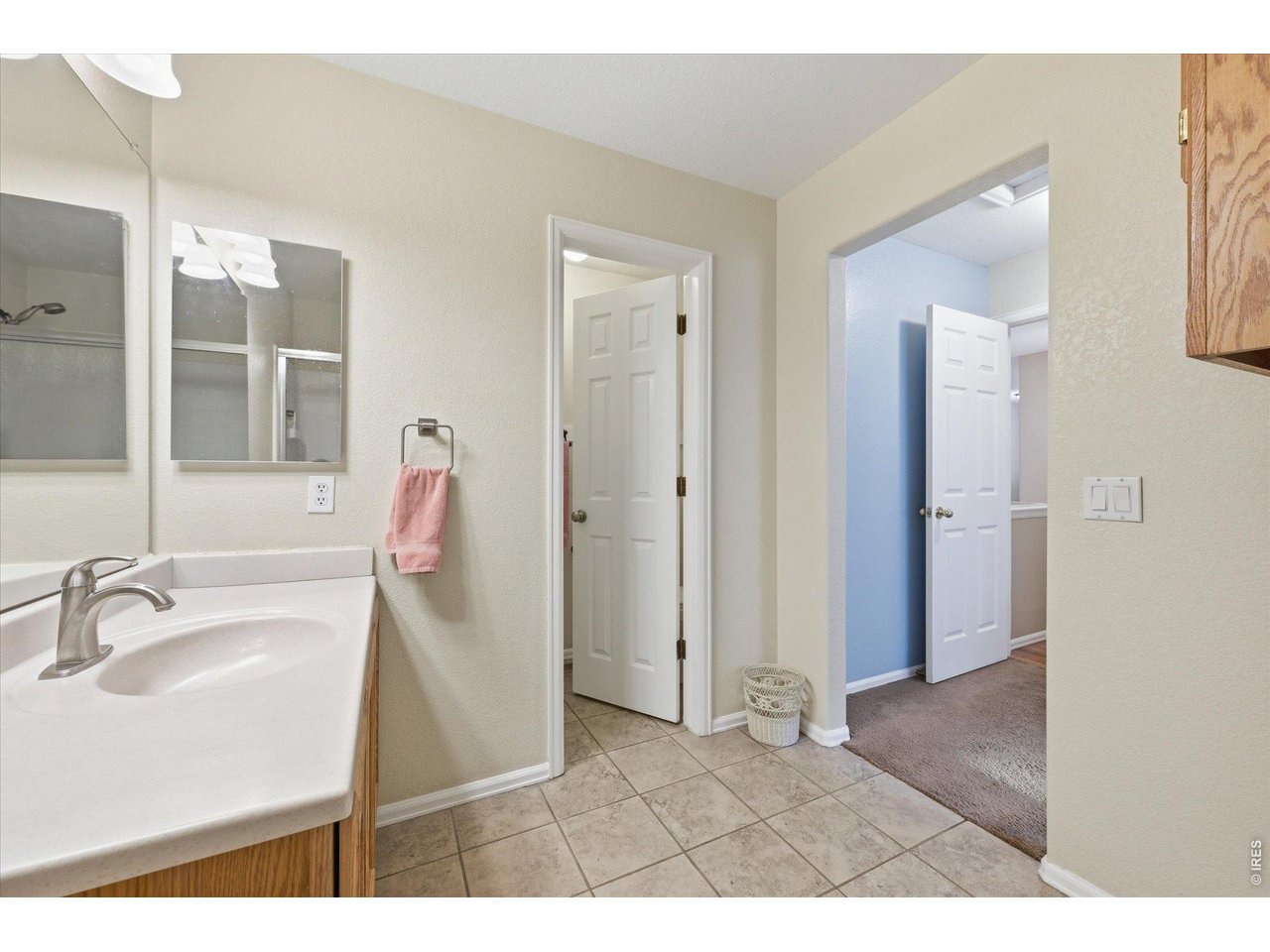 6227 Secrest Lane Arvada, CO 80403 - Photo 14 of 47 a bathroom with a sink and a mirror
