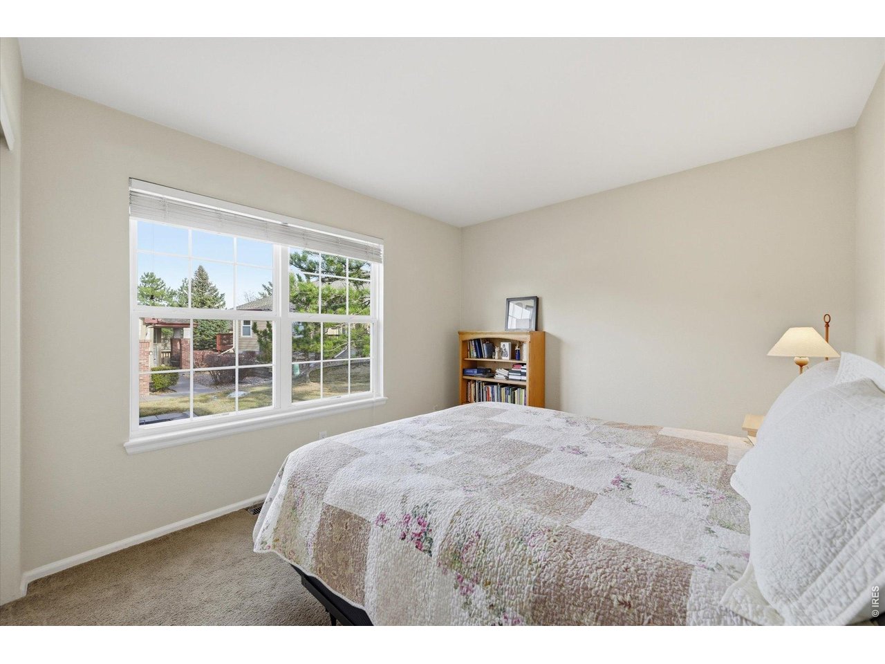 6227 Secrest Lane Arvada, CO 80403 - Photo 15 of 47 a bedroom with a bed and a window