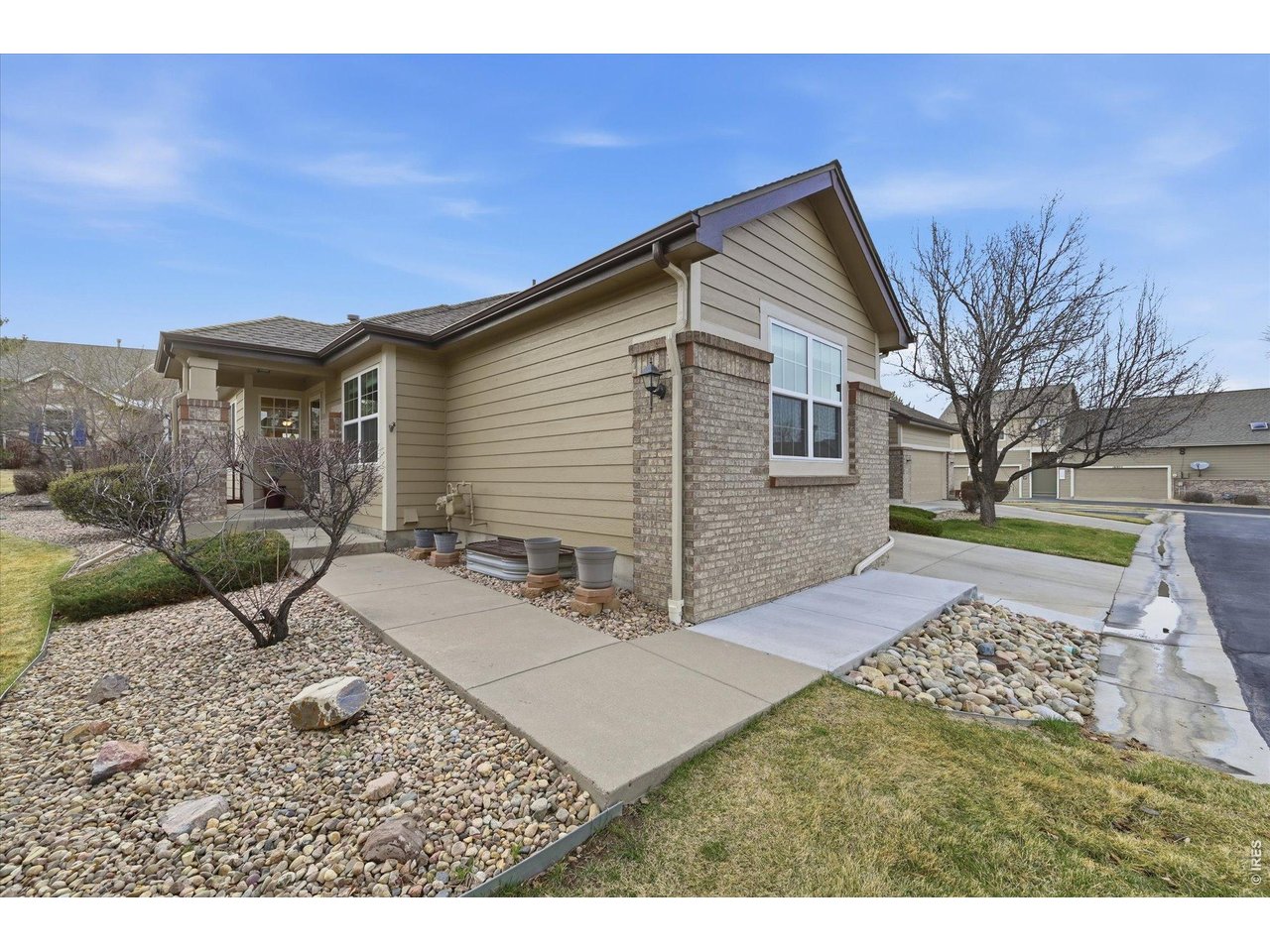 6227 Secrest Lane Arvada, CO 80403 - Photo 2 of 47 a house view with a backyard space