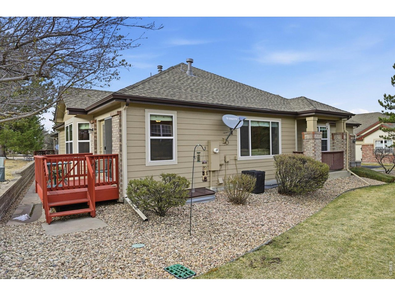 6227 Secrest Lane Arvada, CO 80403 - Photo 21 of 47 a front view of a house with garden