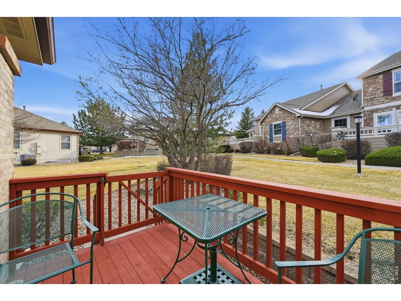 6227 Secrest Lane Arvada, CO 80403 - Photo 24 of 47 a view of a deck with wooden floor and fence