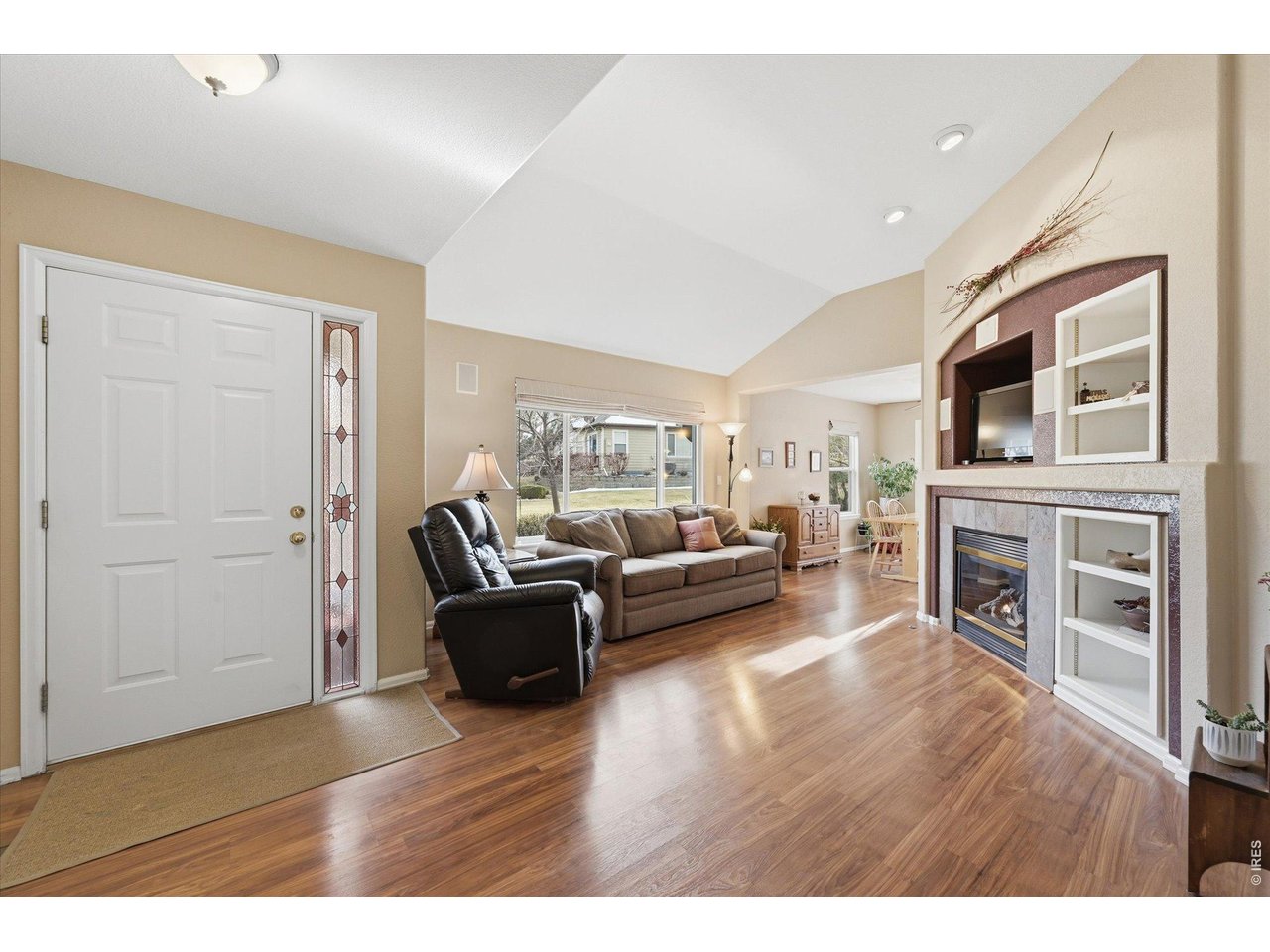 6227 Secrest Lane Arvada, CO 80403 - Photo 3 of 47 a living room with furniture and a fireplace