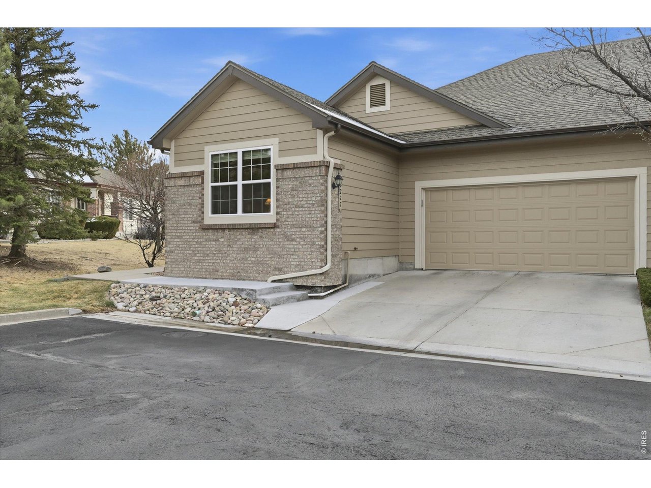 6227 Secrest Lane Arvada, CO 80403 - Photo 33 of 47 a front view of a house with a yard