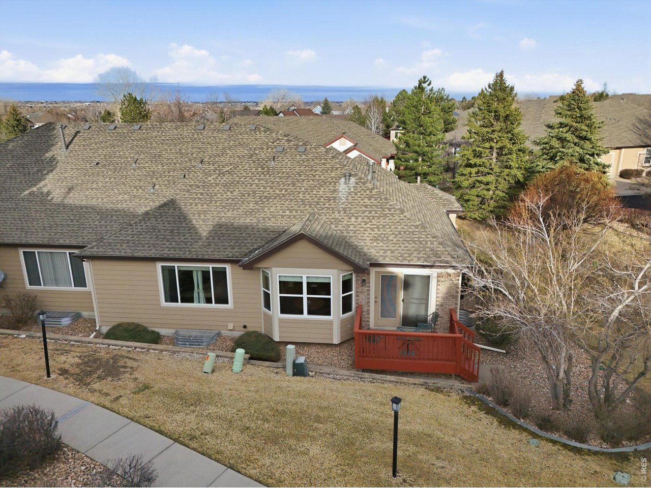 6227 Secrest Lane Arvada, CO 80403 - Photo 46 of 47 a front view of a house with a yard