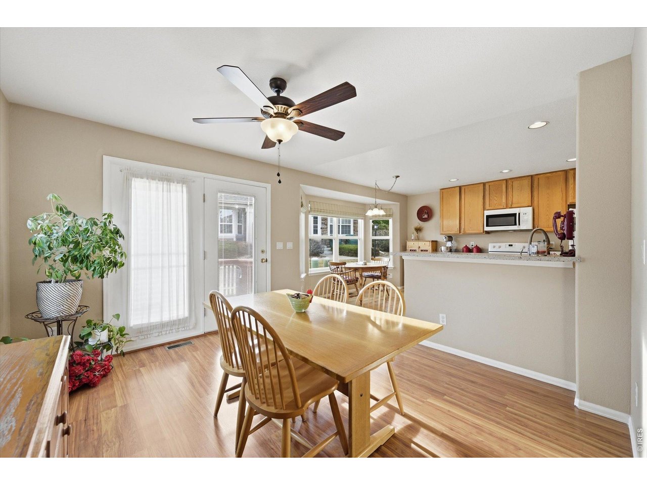 6227 Secrest Lane Arvada, CO 80403 - Photo 6 of 47 a dining room with furniture and window