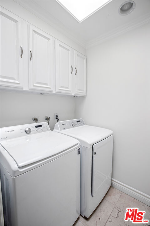 16636 Calneva Drive Encino, CA 91436 - Photo 13 of 18 a utility room with dryer and washer