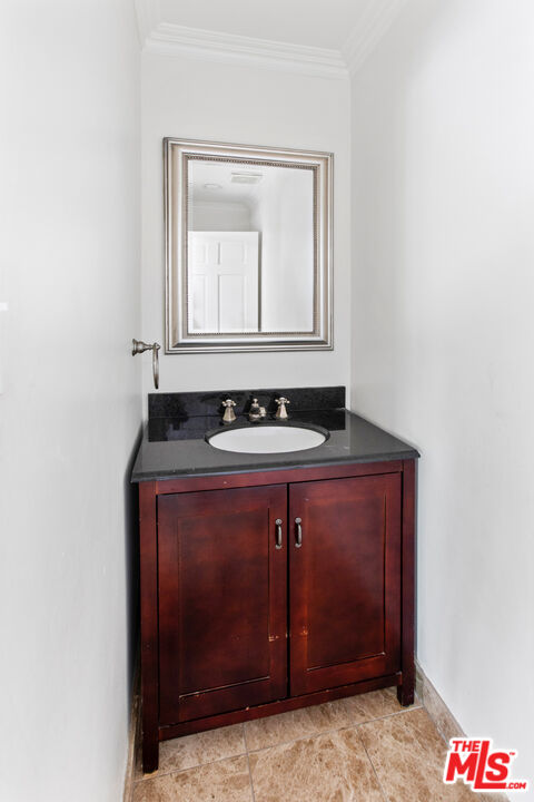 16636 Calneva Drive Encino, CA 91436 - Photo 14 of 18 a bathroom with a sink and a mirror