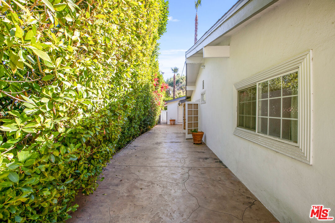 16636 Calneva Drive Encino, CA 91436 - Photo 18 of 18 a view of a pathway of a house with a yard