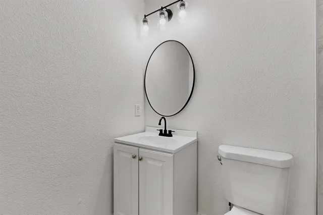 a bathroom with a sink and mirror