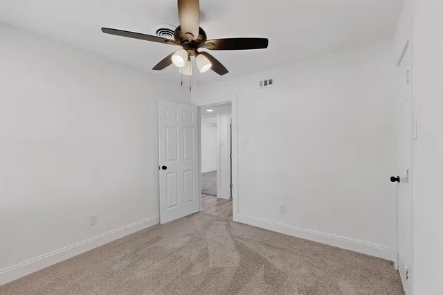 a view of a big room with carpet