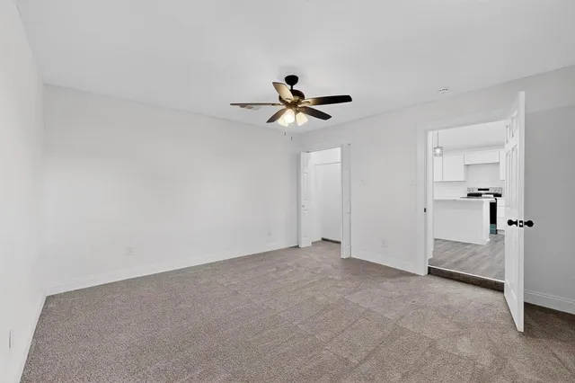 a view of a house with a tree back yard
