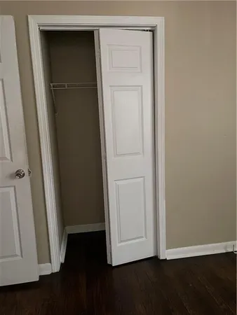 an empty room with wooden floor