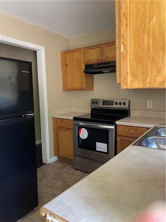 a kitchen with a stove and a microwave