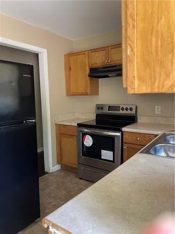 a kitchen with a stove and a microwave