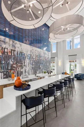 a view of a dining room with furniture and chandelier