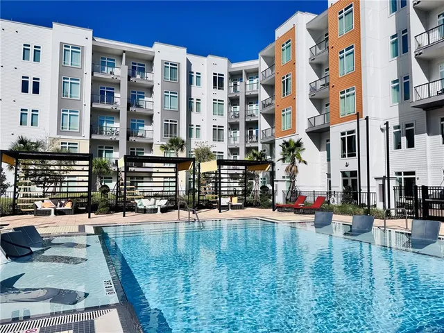 a view of tall building with a yard