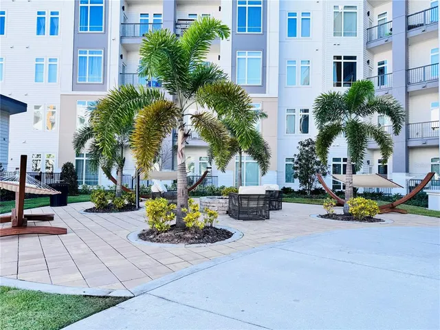 a view of a street with cars and a parked cars