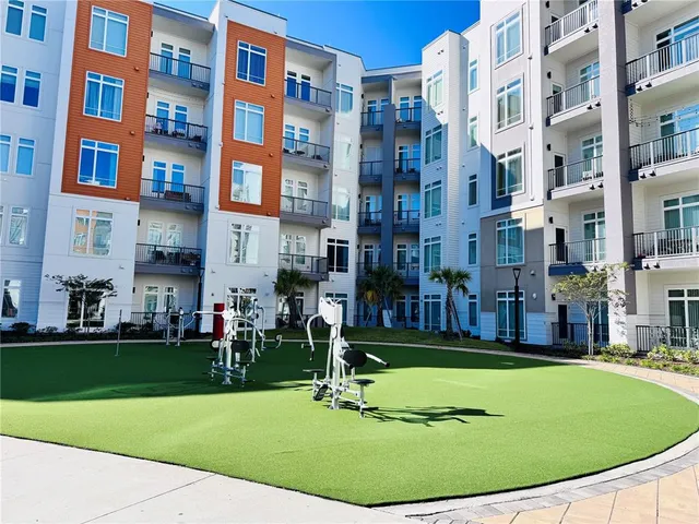 a view of a building with a yard