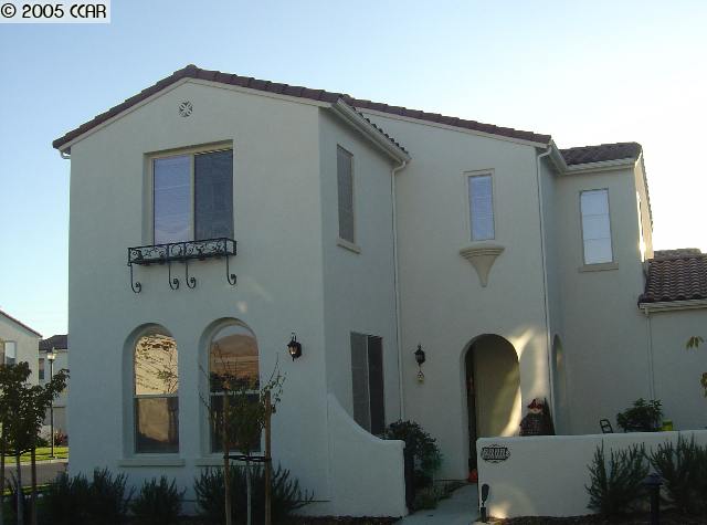 a front view of a house with outdoor space