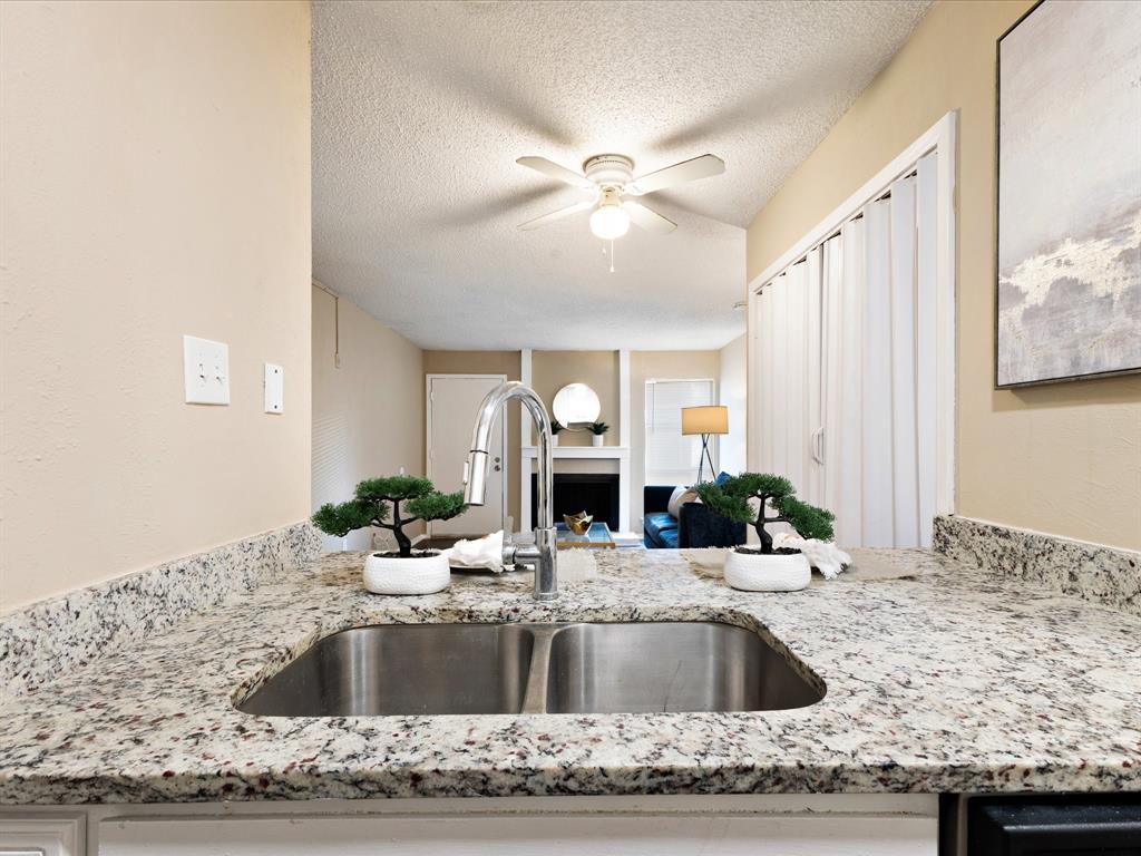 5532 Boca Raton Boulevard, Unit 191 Fort Worth, TX 76112 - Photo 2 of 7 a view of living room with granite countertop furniture and fireplace