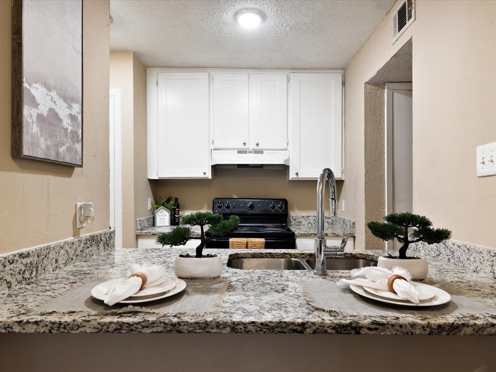 5532 Boca Raton Boulevard, Unit 191 Fort Worth, TX 76112 - Photo 3 of 7 a living room with furniture and a fireplace