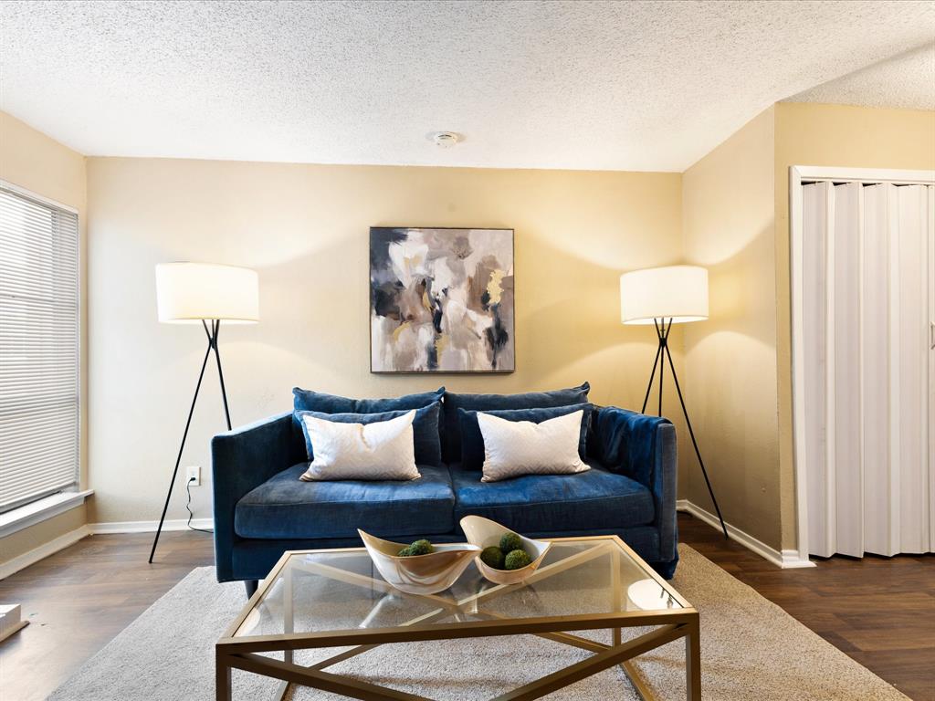 5532 Boca Raton Boulevard, Unit 191 Fort Worth, TX 76112 - Photo 5 of 7 a living room with furniture and a lamp